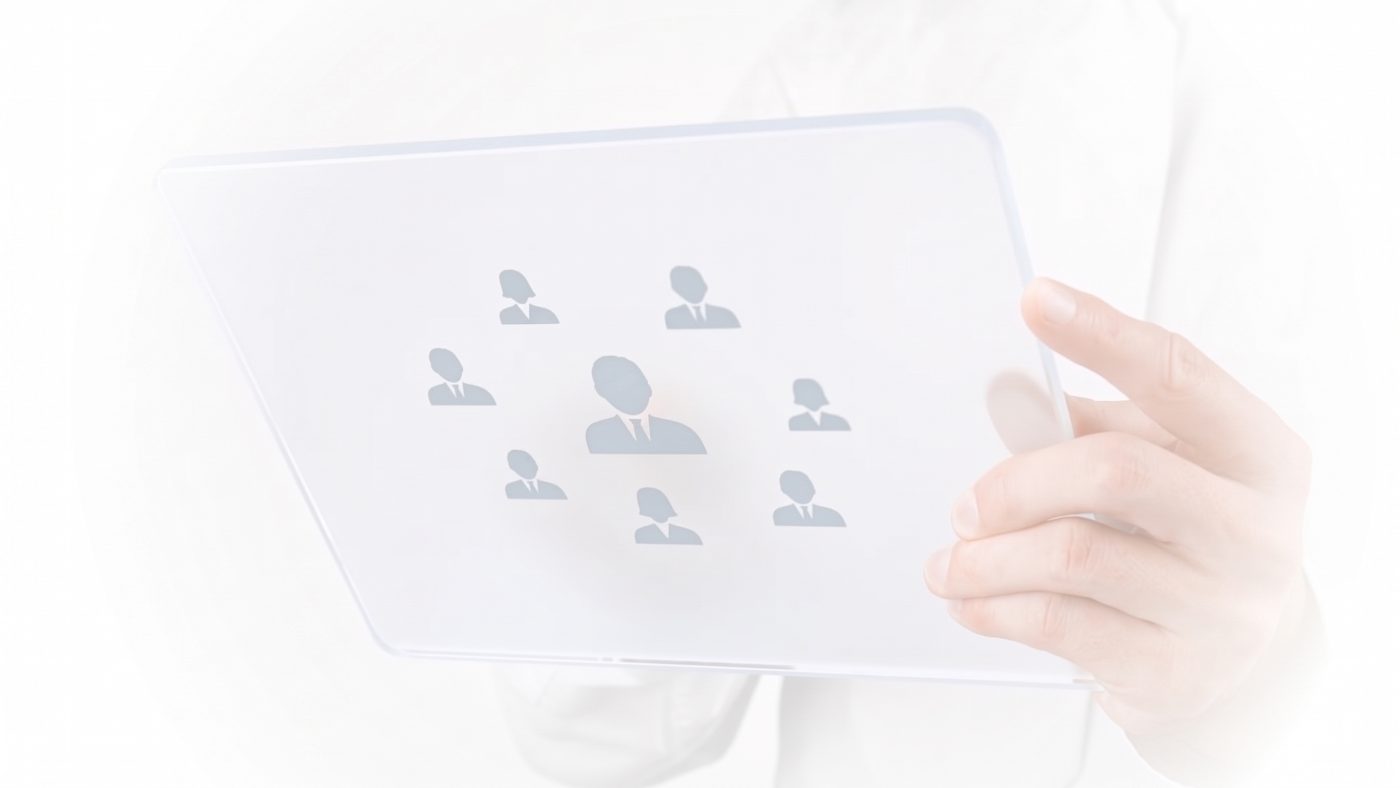 A hand holding a tablet showing a team structure